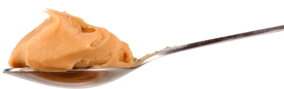 Pasta de amendoim sabor banana em uma colher